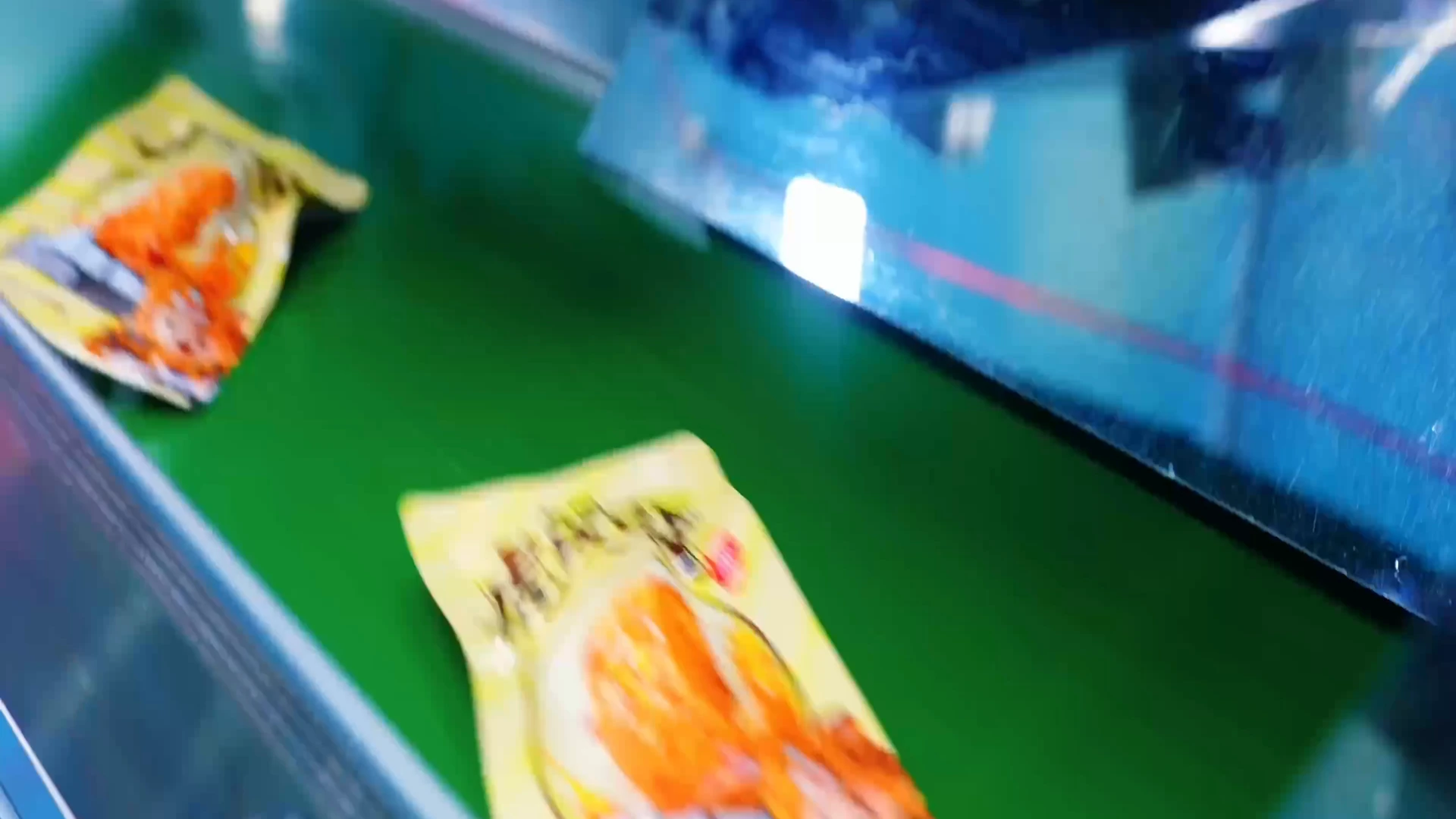 Retail tofu packs moving through a packing line
